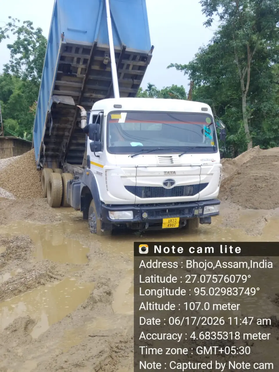 Tipper truck dumping aggregate at stockpile, Assam