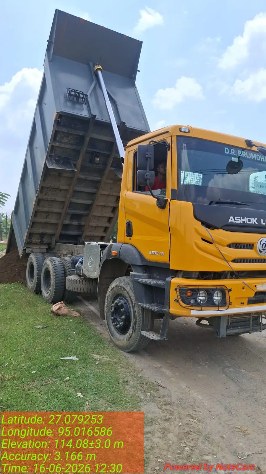 Tipper truck dumping material, Assam